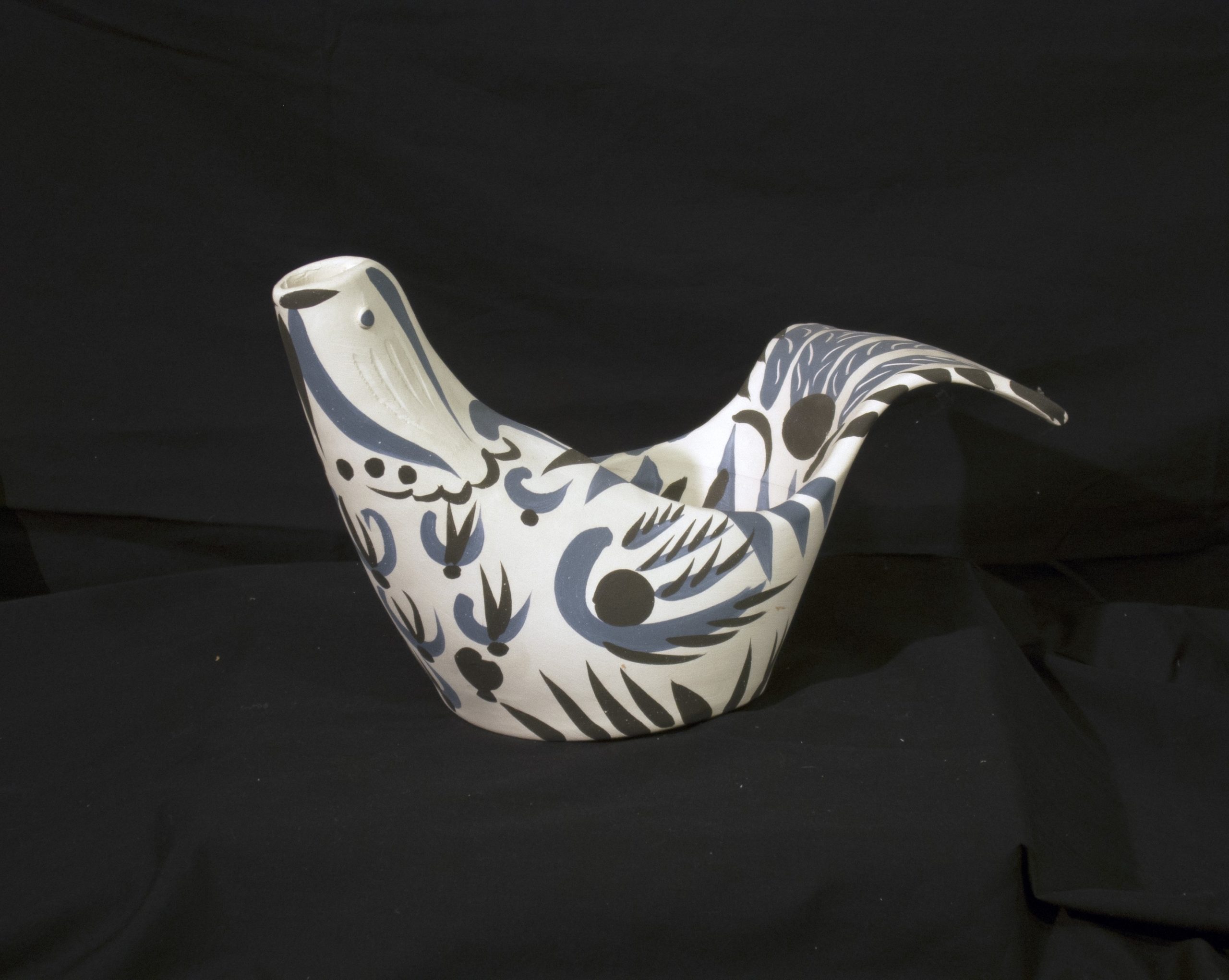 A ceramic sculpture of a dove
