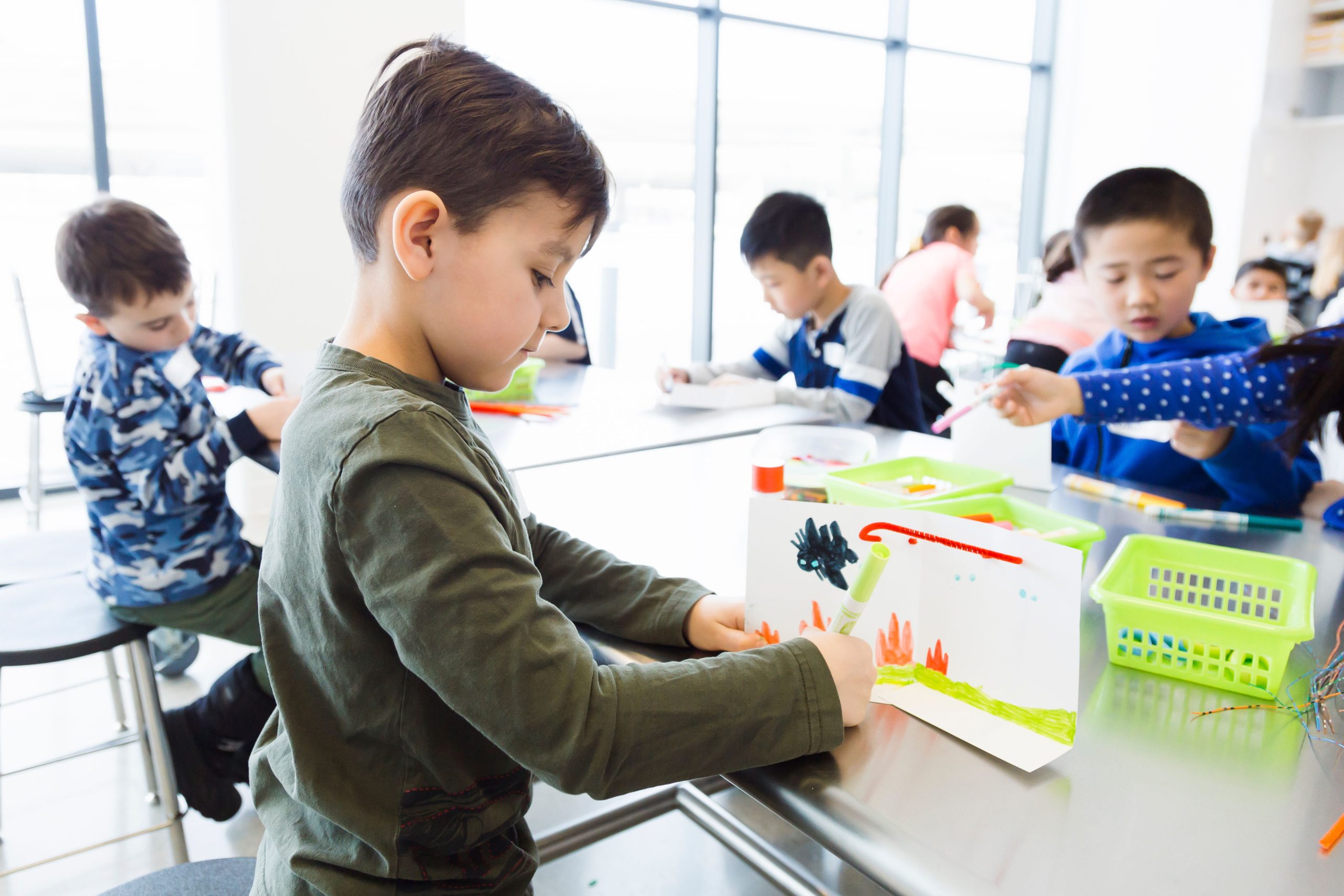 Children make art in the Cameco Learning Studio.