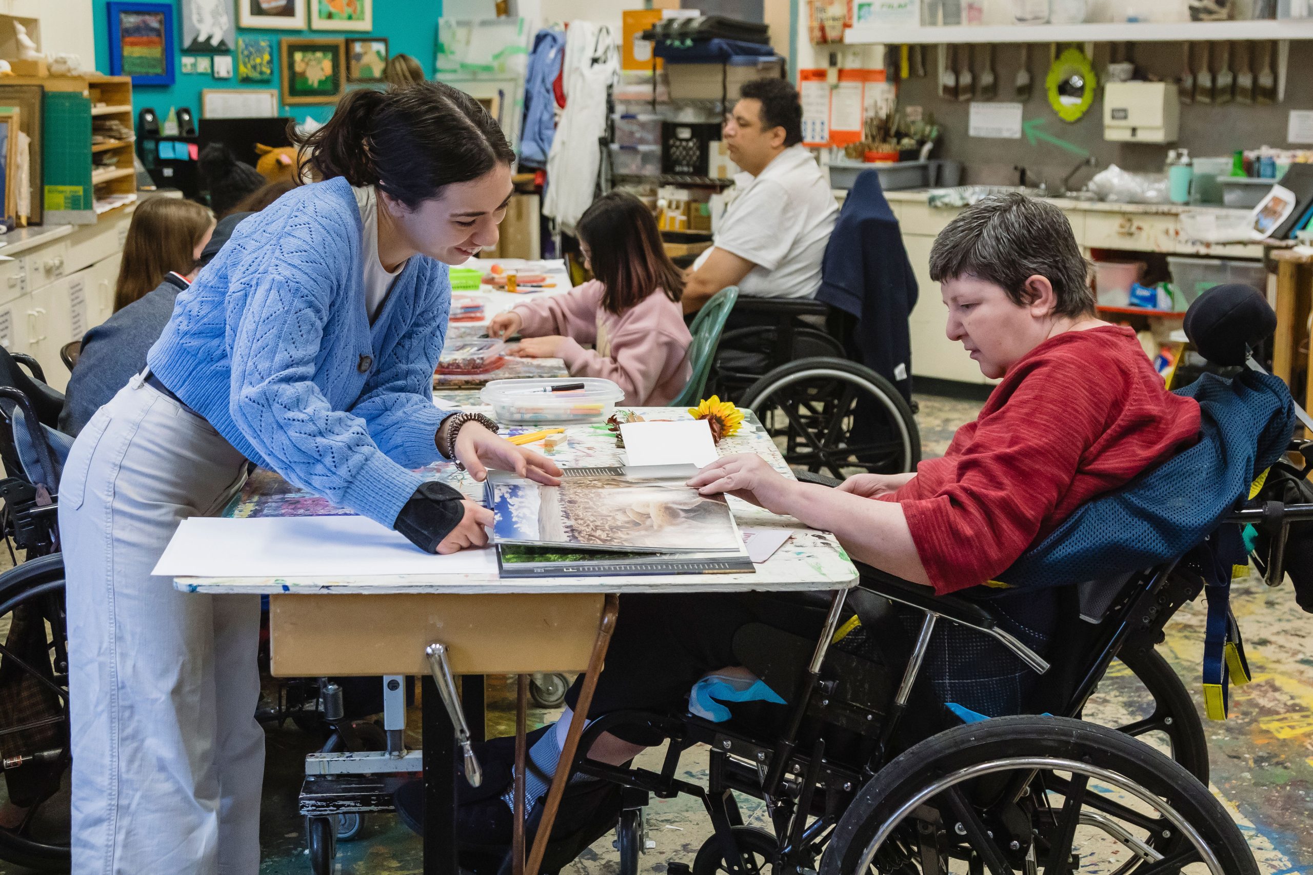 Artist Gabby Da Silva makes art with a resident at Sherbrooke Community Centre.